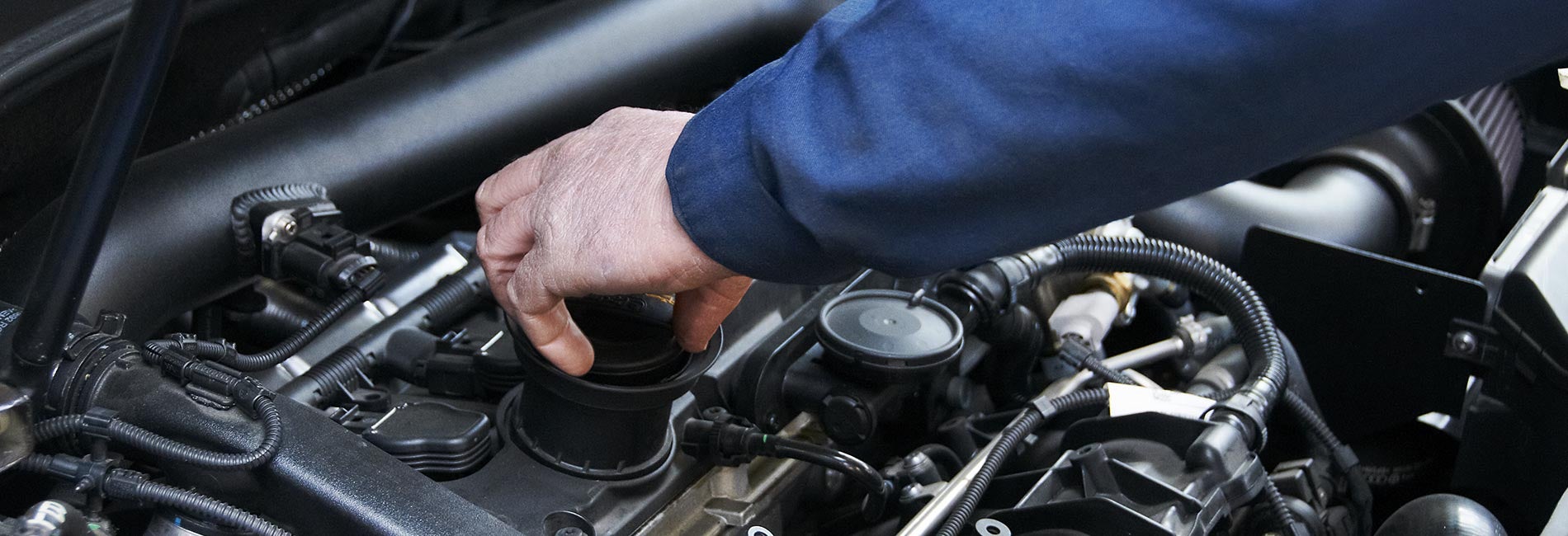 Mechanic replacing fluids